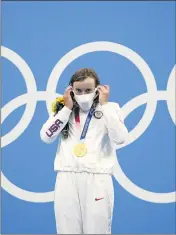  ?? MATTHIAS SCHRADER — THE ASSOCIATED PRESS ?? American Katie Ledecky receives her gold medal for the women’s 1,500-meter freestyle at the Tokyo Olympics.