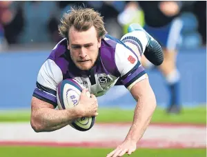  ??  ?? Stuart Hogg gets Scotland off to a great start with his early try.