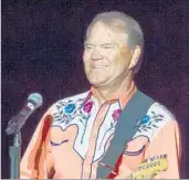  ?? DANNY JOHNSTON/AP ?? Glen Campbell, who died Tuesday at age 81, performs on his farewell tour in 2012 after his Alzheimer’s diagnosis.