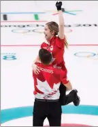  ?? The Associated Press ?? Canadians Kaitlyn Lawes and John Morris win gold during mixed doubles curling action at the 2018 Winter Games in South Korea.