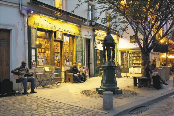  ?? Getty Images / Panoramic Images ?? The English-language bookstore Shakespear­e and Company in Paris, founded in 1919 by an American, is a bookworm’s dream.