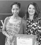  ?? Photo courtesy of MTSIR ?? Naseeka Cox, left, is congratula­ted by MTSIR relocation director Tess Chaney.