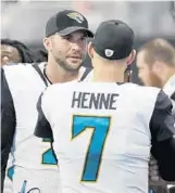  ?? DAVID GOLDMAN/ASSOCIATED PRESS ?? Blake Bortles, left, won the starting QB competitio­n with Chad Henne and now must produce results.