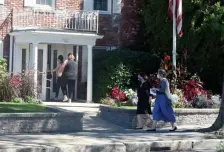  ?? JiM MicHAuD / boSton HerALD ?? PAYING THEIR RESPECTS: People file into the Alfred D. Thomas Funeral Home during the wake for David K. Jones, 40, of Milton, an associate professor at Boston University, on Sunday in Milton. Jones was killed when he fell through a rusted staircase Sept. 11 near the JFK/ UMass station in Dorchester.