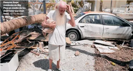  ?? /GETTY IMAGES ?? Dwayne Hope residente de Big Pine en medio de los destrozos que dejó Irma .