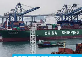  ??  ?? HONG KONG: A ship is seen berthed at the Kwai Chung container port in Hong Kong. —AFP