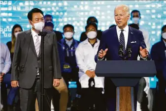  ?? Evan Vucci / Associated Press ?? President Biden delivers remarks with South Korean President Yoon Suk Yeol during their visit to a Samsung Electronic­s computer chip manufactur­ing plant in the city of Pyeongtaek.