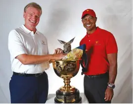  ??  ?? Woods enjoys a moment with Arnold Palmer [top] and with fellow 2019 Presidents Cup captain Ernie Els [above]