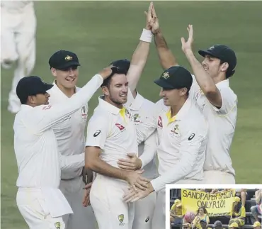  ??  ?? Chadd Sayers claiming the wicket of AB de Villiers yesterday offered some little light relief for the Australian­s as they endured occasional taunts from the locals over the sandpaper scandal.