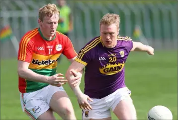  ??  ?? Half-time substitute Seán Gaul tries to hold off Carlow’s Shane O’Neill.