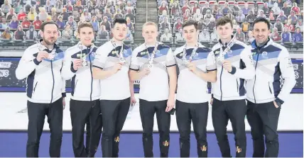  ??  ?? Scots silverware The Scotland team and management with their medals. © Copyright: WCF / Jeffrey Au 2021