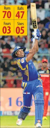  ??  ?? Mumbai Indians batsman Kieron Pollard looks on after playing a shot during the match against RCB.