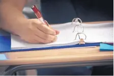  ?? JOURNAL FILE ?? A Del Norte High School student in the Advancemen­t Via Individual Determinat­ion program takes notes during class.