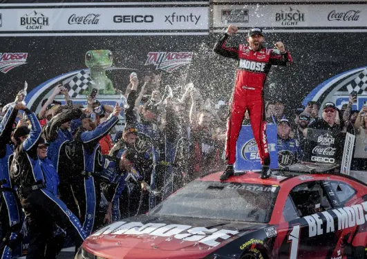  ?? Butch Dill, The Associated Press ?? Ross Chastain celebrates his win atop his car in Victory Lane after a NASCAR Cup Series auto race Sunday in Talladega, Ala.