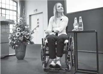  ??  ?? Germany’s Olympic and world sprint cycling champion Kristina Vogel sits in a wheelchair as she gives a news conference — her first since she was paralyzed following a serious crash in training on June 26 — at the Unfallkran­kenhaus hospital in Berlin, the German capital, yesterday. — AFP