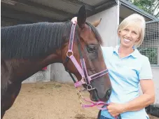  ??  ?? Gold Coast trainer Gillian Heinrich with Military Rose before the win in 2010.