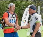  ?? MARATHON PHOTOS ?? Steve Gurney, right, congratula­tes Richie McCaw on arrival at Klondyke Corner at last year’s Coast to Coast. Both will be competing in this weekend’s Red Bull Defiance adventure race in Wanaka.