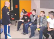  ?? TIMES photograph by Kent Marts ?? A group of Pea Ridge High School seniors discuss Army life with recruiter Sgt. 1st Class Wesley C. Nally during the school’s career day on Thursday.