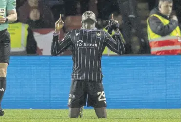  ?? ?? St Johnstone’s Benjamin Kimpioka celebrates scoring to make it 2-0 against Aberdeen at Pittodrie