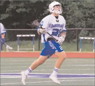  ?? Photo by Colby Cotter / SRI Newspapers ?? Cumberland junior attack Jack Hayes (21) scored five of his team’s 15 goals in a 15-3 victory over No. 8 Narraganse­tt Thursday night in a Division II quarterfin­al match at Tucker Field.