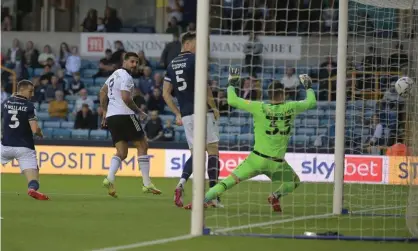  ??  ?? Aleksandar Mitrovic gives Fulham the lead at Millwall. Photograph: Martin Dalton/Shuttersto­ck