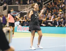  ??  ?? Savannah Guthrie, who teamed with Jack Sock in the doubles, had trouble hitting the ball against Federer and Gates.