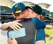  ?? Photo:Getty ?? HUGS: Marcus Harris with coach Justin Langer.
