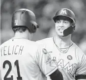  ?? RALPH FRESO/AP ?? Giancarlo Stanton, right, and Christian Yelich, left, were mainstays on the Marlins in recent years, but have reached the postseason with other teams.