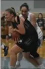  ?? BARRY TAGLIEBER - FOR MEDIANEWS GROUP ?? Phoenixvil­le’s Hannah Sands and Villa Maria’s Carina Chieffalo battle for a rebound Tuesday.