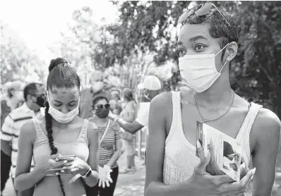  ?? Melissa Phillip / Staff file photo ?? Jordin Williams waits in line outside the South County Community Center during early voting last October in The Woodlands. The Texas Senate has just passed SB 7, another attack on ballot access under the guise of “election integrity.”