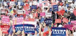  ??  ?? Donald Trump arrives to hundreds of his cheering supporters for a tarmac rally Tuesday at the Orlando Sanford Internatio­nal Airport in Sanford.