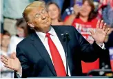  ?? — AP ?? President Donald Trump reacts to West Virginia’s state song at a rally in Wheeling on Saturday.