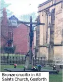  ??  ?? Bronze crucifix in All Saints Church, Gosforth