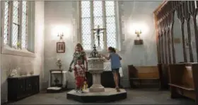  ?? MARY ALTAFFER — ASSOCIATED PRESS ?? Amanda Morales’ children, Daniela Carvajal, right, Dulce Carvajal, left, and David Carvajal, foreground, play inside the Holyrood Church Thursday in the Washington Heights neighborho­od of Manhattan. Morales, who is originally from Guatemala and has...