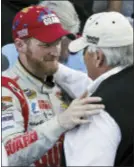  ?? STEVE HELBER — THE ASSOCIATED PRESS FILE ?? In this file photo, Dale Earnhardt Jr. celebrates winning the NASCAR Sprint Cup Series auto race with team owner Rick Hendrick, front right, in Victory Lane at Martinsvil­le Speedway in Martinsvil­le, Va. Earnhardt Jr. will retire at the end of this...