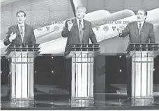  ?? MICHAEL CIAGLO, POOL PHOTO ?? Republican presidenti­al candidates Marco Rubio, Donald Trump and Ted Cruz in Houston last Thursday.