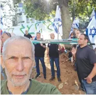  ?? (Omer Bar-Lev/Twitter) ?? OMER BAR-LEV attends a protest with other IDF veterans against the government’s planned judicial overhaul and mass military exemptions in the haredi sector, in Bnei Brak, earlier this month.