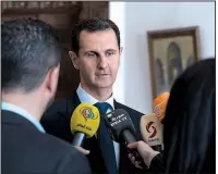  ?? AP/Syrian presidency Facebook ?? President Bashar Assad speaks with reporters Sunday in Damascus, Syria.