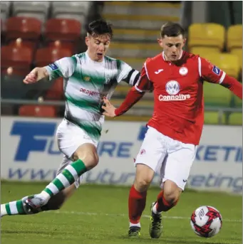  ??  ?? Calum Waters gets away from Ronan Finn. Pic: George Kelly.