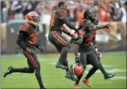  ?? DAVID RICHARD — THE ASSOCIATED PRESS ?? Browns players celebrate after they defeated the Ravens in overtime Oct. 7 in Cleveland.