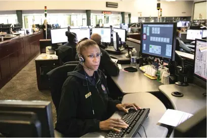  ?? ASHLEE REZIN/SUN-TIMES ?? A police communicat­ions operator at the city’s Office of Emergency Management and Communicat­ions is shown at work on Nov. 22, 2017.