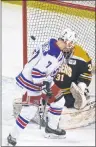  ?? JASON SIMMONDS/JOURNAL PIONEER ?? Summerside D. Alex MacDonald Ford Western Capitals forward Austin Taylor screens Campbellto­n Tigers goaltender Tristan Gray as this shot just missed the corner of the net.