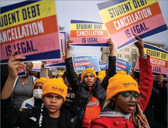  ?? KENT NISHIMURA — LOS ANGELES TIMES/TNS ?? People rally to show support for the Biden administra­tion’s student debt relief plan in front of the Supreme Court last month. The case hinges on whether student loan debt relief is in keeping with the parameters of the HEROES Act.