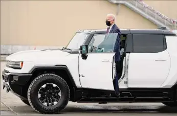  ?? Evan Vucci / Associated Press ?? President Joe Biden gets into a Hummer to drive it on Wednesday at the General Motors Factory ZERO electric vehicle assembly plant in Detroit.