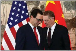  ?? AP/ANDY WONG ?? Treasury Secretary Steve Mnuchin (left) and U.S. Trade Representa­tive Robert Lighthizer confer Wednesday before a group photo session after their meeting with Chinese Vice Premier Liu He in Beijing.