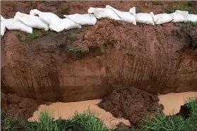  ?? Staff photo by Jerry Habraken ?? The trench surroundin­g Mark Hannibal’s home is 5 feet wide and 10 feet deep.