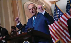  ?? The Associated Press ?? ■ Senate Majority Leader Chuck Schumer, D-N.Y., speaks with reporters following a closed-door caucus lunch on June 22 at the Capitol in Washington. Senate Democrats want to boost taxes on some high earners and use the money to extend the solvency of Medicare, the latest step in the party’s election-year attempt to craft a scaled back version of the economic package that collapsed last year, Democratic aides have told The Associated Press.