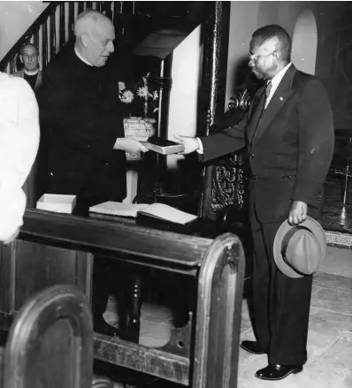  ??  ?? A gift of a Bible was given to President Tubman when he attended a short service at the Coke Methodist Church on November 20, 1954, some minutes before his departure for Liberia. Rev Hartley Totty made the presentati­on to His Excellency.