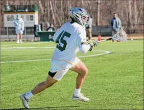  ?? Olivia Witkowski / Siena Athletics ?? Senior defenseman Sam Dichristin­a helped spark Siena in the second half with his third-quarter goal. The Saints rallied to top Umass Lowell.