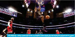  ?? — AFP ?? LOS ANGELES: LeBron James #23 of the Los Angeles Lakers dunks the ball during the second half of a game against the Toronto Raptors at Crypto.com Arena on January 09, 2024 in Los Angeles, California.